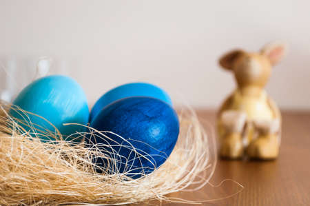 Blue Easter eggs and Easter bunnyの写真素材