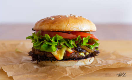 Hamburger with hot peppers on gray paperの写真素材