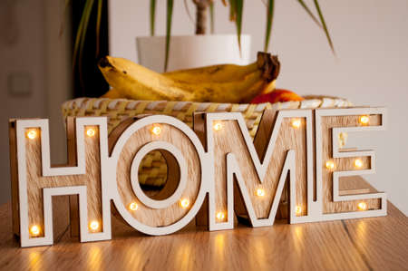 The text "home" on the background of the fruit basketの写真素材