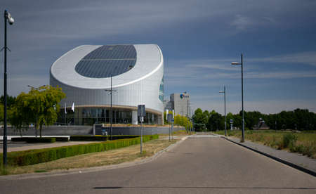 Sittard, Netherlands - 05.31.2020 SABIC European Head Office. Against the background of blue sky and the adjacent parking lot.のeditorial素材