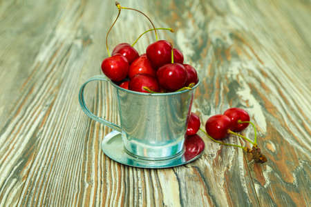 Fresh red Cherries on wooden table macro backgroundの写真素材