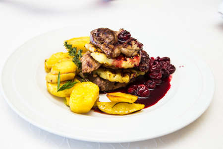 Turkey steak with potaoes and pinnappleの写真素材