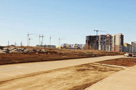 Construction of multi-storey apartment buildings on the outskirts of the city.の写真素材