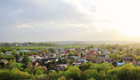 Individual houses on the outskirts of the city in the evening.の写真素材