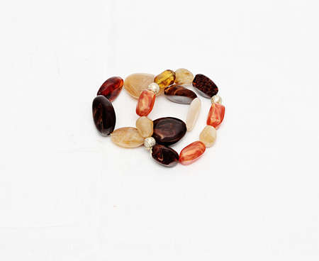Two female bracelets from semi-precious stones isolated against white background.の写真素材