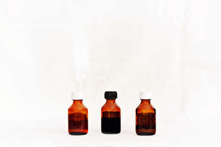 Three bottles with medicinal tinctures isolated white background.の写真素材