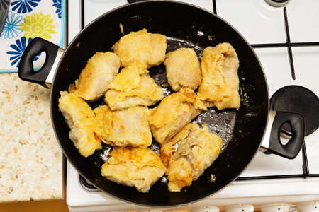 Fried in margarine in a frying pan stuffed with meat and cabbage.の写真素材