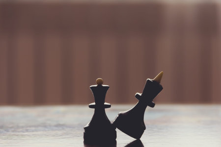 Two chess pieces king and queen are black.