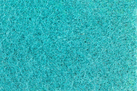 The texture of a sponge for washing dishes with a fine pile.の写真素材