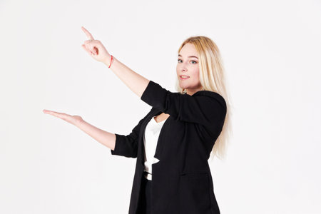 Studio portrait of a blonde girl with gestures. Reference photo for various projects.の写真素材