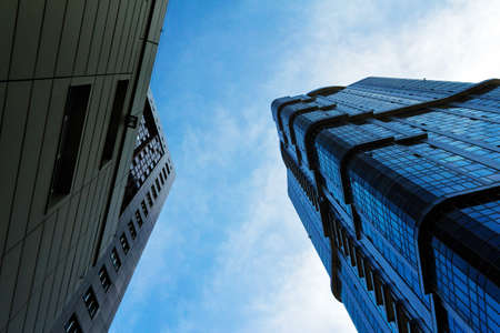View of modern multi-storey residential buildings against the backdrop of a cloudy sky.の写真素材
