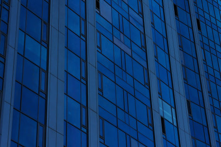 Part of a modern residential building made of glass close-up.