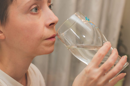 The woman is going to drink fresh drinking water.