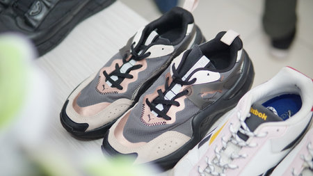 Pair of sport shoes in the store. Shallow depth of field.の写真素材
