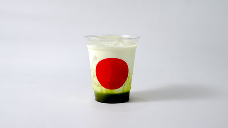 Iced green tea red mark on plastic cup white background.の写真素材