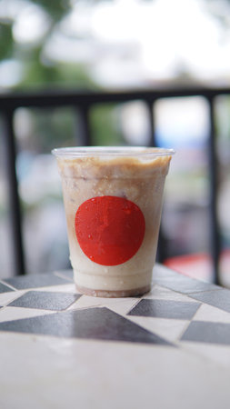 Iced coffee in plastic cup with red mark at the front cupの写真素材