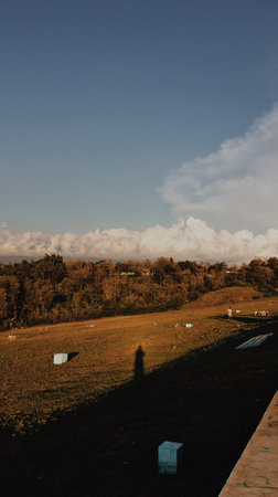 Beautiful cloudy potrait nature view in the morning with human shadowの写真素材