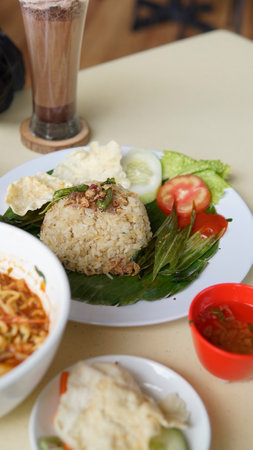 Rice topped with spicy and sour sauce, Thai style food.の写真素材