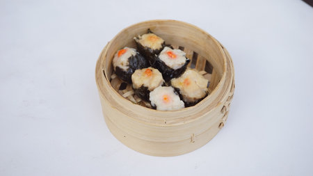 Chinese dim sum in bamboo basket on white background, chinese foodの写真素材
