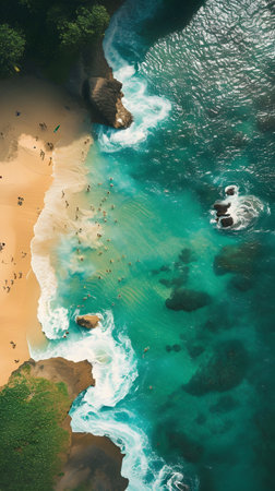 Aerial view of beautiful sandy beach and turquoise ocean with surfersの素材
