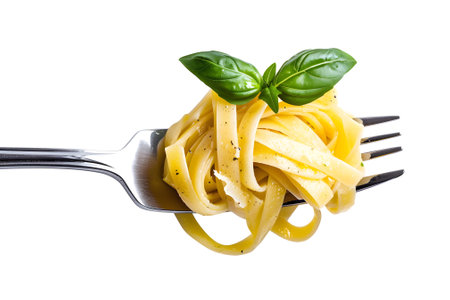 Spaghetti with pesto sauce on a fork isolated on white backgroundの素材
