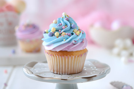 Cupcake with buttercream frosting and sprinkles on topの素材