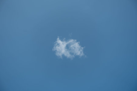 Small white cloud in the blue sky