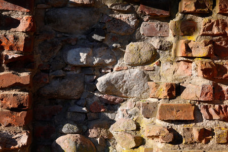 Red wall made of bricks and recessの写真素材