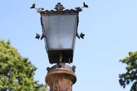 Electric lamp on blue background in the parkの写真素材