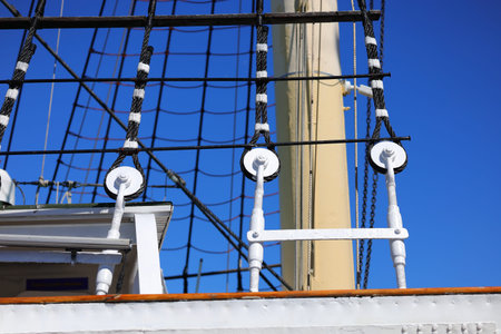 Three white circles and black ropes on the ship