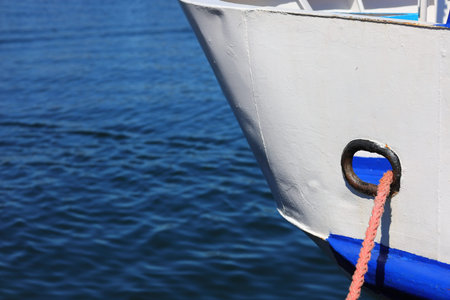 White ship bow and the mooring rope