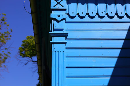 Wooden wall of orthodox church and the blue sky
