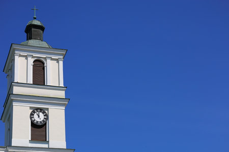 The clock on white tower and the blue skyの写真素材