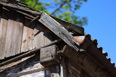 Wooden roof edge and an old gutter