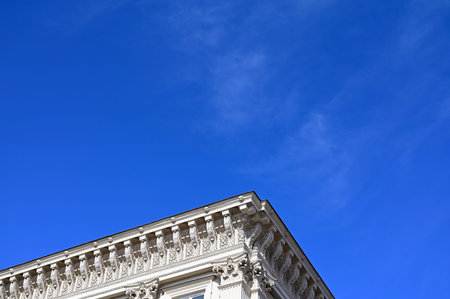 Decorative corner of the building and the blue sky