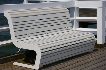Wooden white bench on the bridgeの写真素材