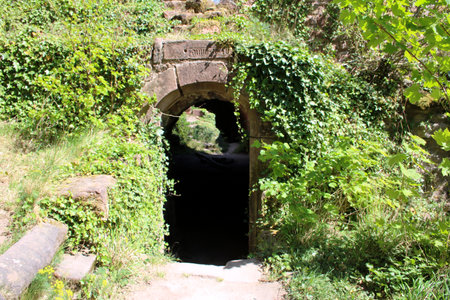 Entrance to the old stone bridge in the forest. Ukraine.の写真素材