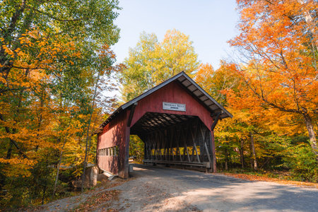 Autumn in Stowe Vermont Brookedale Covered Bridge Historic Red Wooden Roof Over Road Into Colorful...