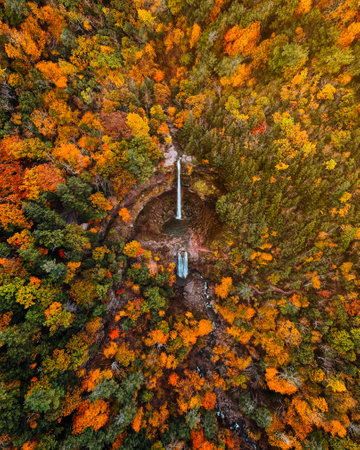 Epic Aerial Drone Waterfall Oasis Kaaterskill Falls New York Catskills in Forest Fall Foliage. Birds Eye View Drone Landscape Wide Beautiful Natureの写真素材