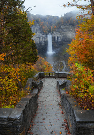 Autumn Season Stone Path Waterfall Scenic Viewpoint. Fall Foliage Taughannock Falls Fingerlakes New York New England.の写真素材