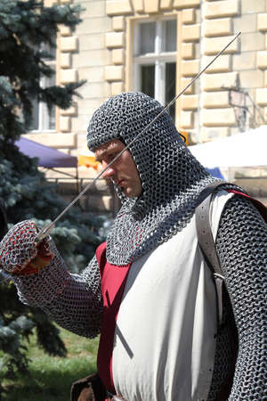 squire checking his swordの写真素材