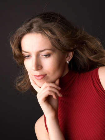 The beautiful girl in studio on a black background.の写真素材