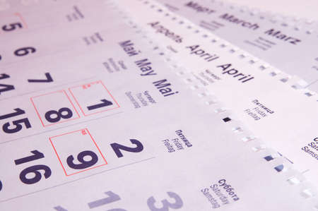 Calendar page light red, focus on the month of May.の写真素材