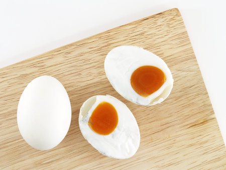 salted eggs on a wooden cutting board