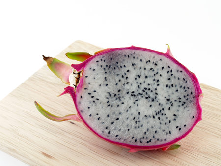 Dragon fruit on wooden cutting board