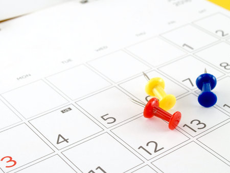 desk calendar with days and dates in July 2016 and colorful thumbtack, acronym letters US in the fourth of July, the symbol of American Independence Dayの写真素材