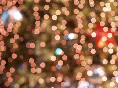 defocused small colorful Christmas lights bokeh, blurred lights abstract backgroundの写真素材