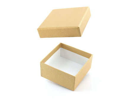 close-up golden gift box open and empty isolated on white background, close up carton box wrapped in...