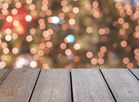 close-up empty dark brown wooden table top with defocused small colorful lights bokeh on Christmas...