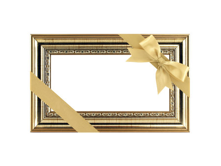 close up single antique golden picture frame with yellow gold diagonal ribbon bow and copy space...
